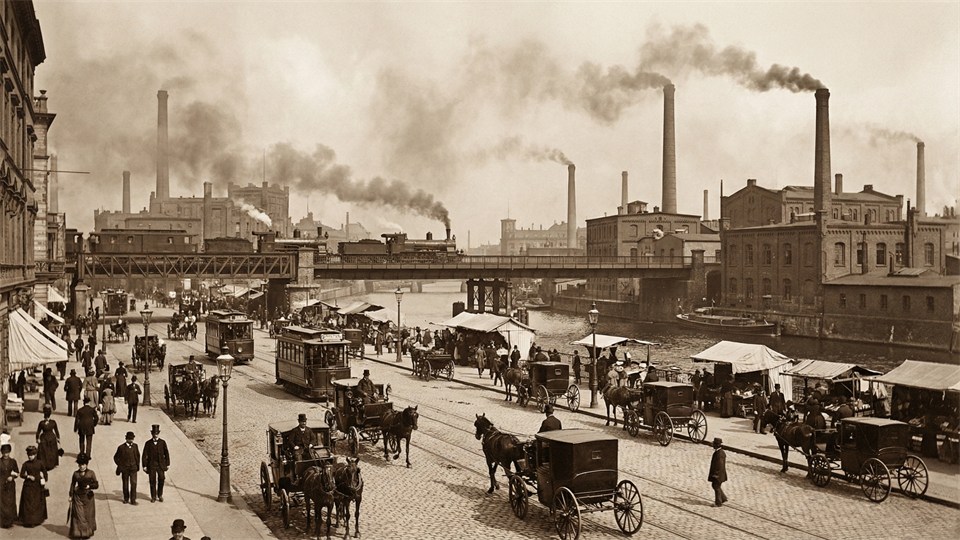Berlin during the industrial age with trains, factories, and busy streets